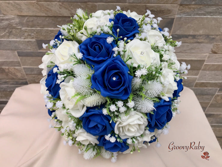 Royal Blue Foam Roses With Off White Thistle & Gypsophila