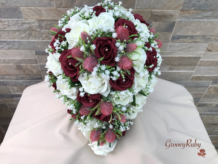 Burgundy Thistle With Foam Roses & Gypsophila