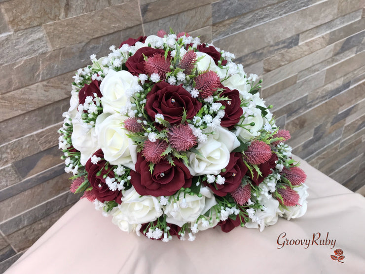 Burgundy Thistle With Foam Roses & Gypsophila