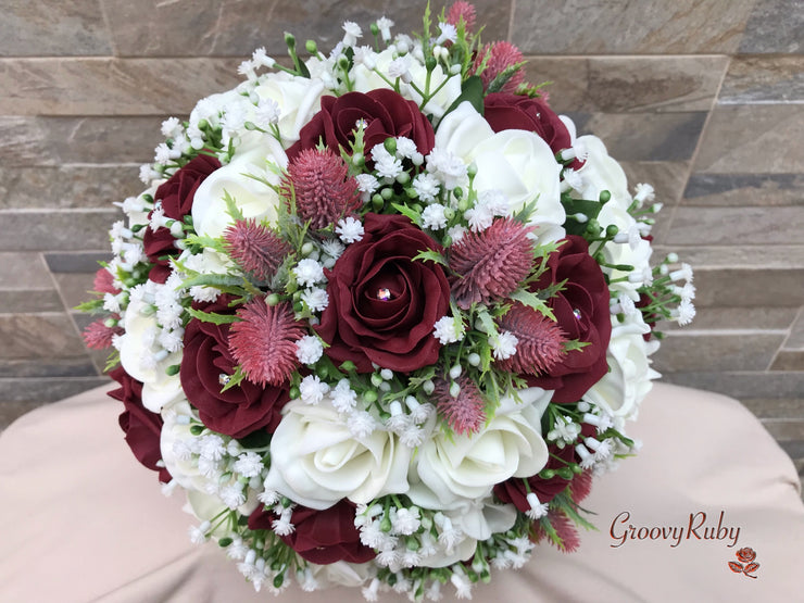Burgundy Thistle With Foam Roses & Gypsophila