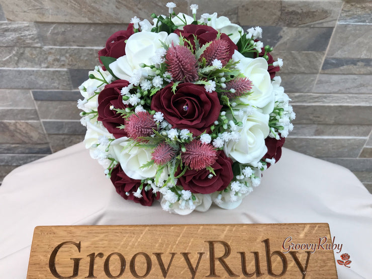Burgundy Thistle With Foam Roses & Gypsophila