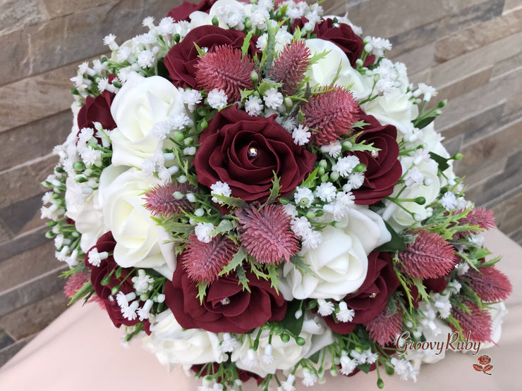 Burgundy Thistle With Foam Roses & Gypsophila