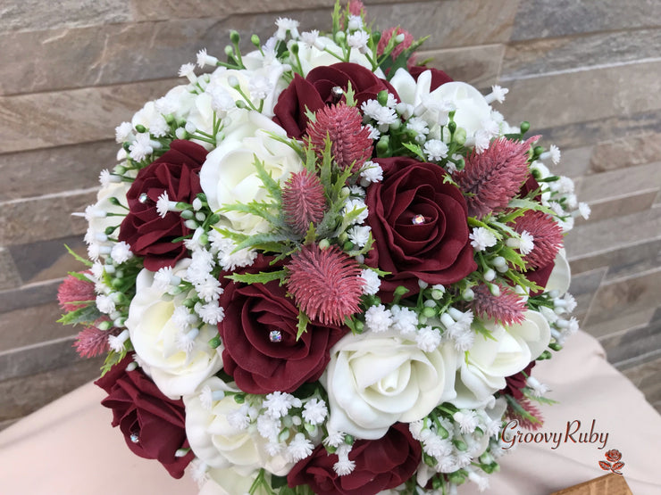 Burgundy Thistle With Foam Roses & Gypsophila