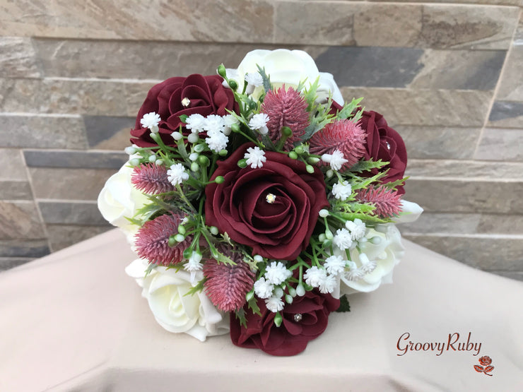 Burgundy Thistle With Foam Roses & Gypsophila