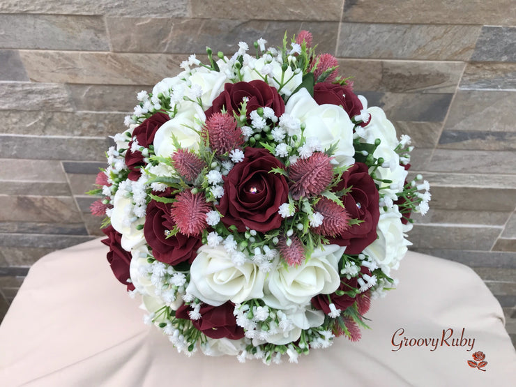 Burgundy Thistle With Foam Roses & Gypsophila