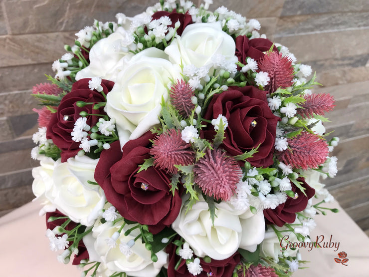 Burgundy Thistle With Foam Roses & Gypsophila