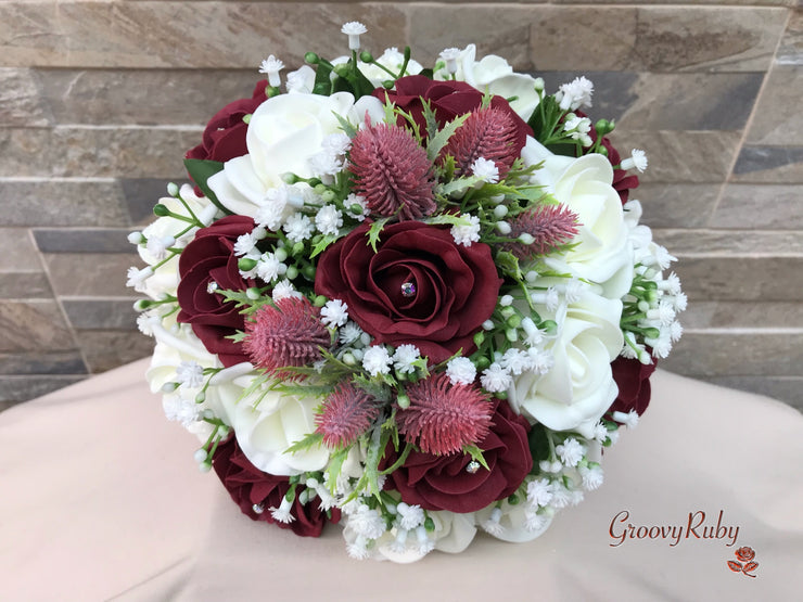 Burgundy Thistle With Foam Roses & Gypsophila
