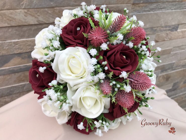 Burgundy Thistle With Foam Roses & Gypsophila