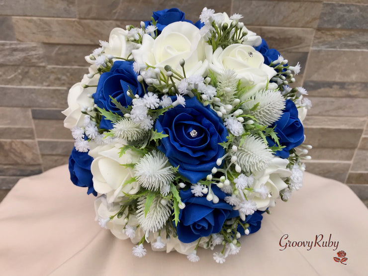 Royal Blue Foam Roses With Off White Thistle & Gypsophila