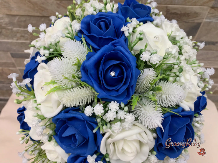 Royal Blue Foam Roses With Off White Thistle & Gypsophila